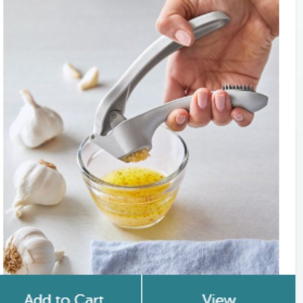 New, in box, Pampered Chef Garlic Press